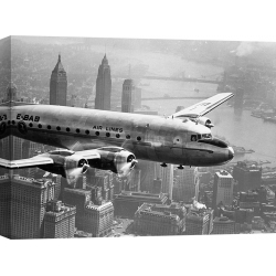 Wall art print and canvas. Aircraft Flying over City, 1946